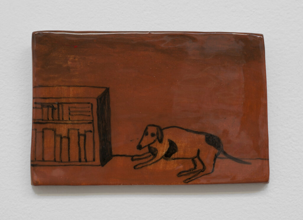 17.3 Noel McKenna_dog bookcase_2023_Hand painted ceramic tile_9.2 x 14.2 cm_Copyright the artist and mother's tankstation limited